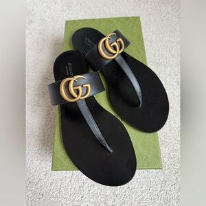 Gucci Black Slides with Gold Accents